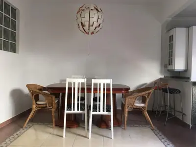 a dining room with a wooden table and chairs at Malvarrosa Calle Pavia in Valencia