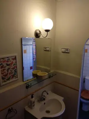 a bathroom with a sink and a mirror at Centro con encanto. in Valencia