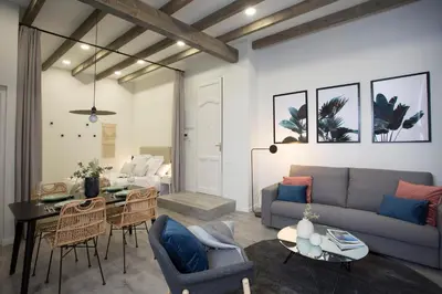 a living room with a couch and a table at Buenos Aires Apartments in Valencia