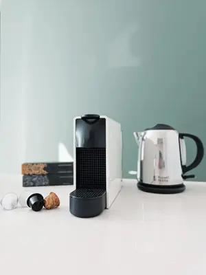 a coffee maker and a toaster on a counter at BONNIES Suites & Spa Valencia in Valencia