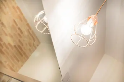 a room with two lights hanging from a wall at Casa del Patriarca in Valencia