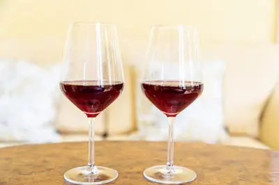 two glasses of red wine sitting on a table at My Loft 4 You Gran Via in Valencia