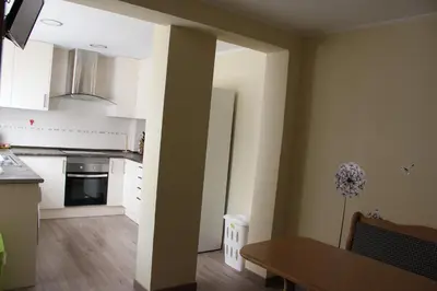 a kitchen with a table and a dining room at CasaMalva in Valencia