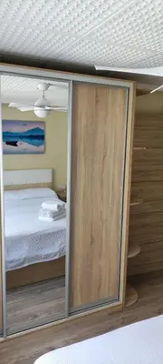 a bedroom with a bed and sliding glass doors at CasaMalva in Valencia