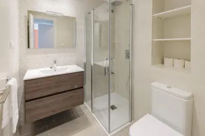 a bathroom with a shower and a sink and a toilet at Turia in Tavernes de Valldigna