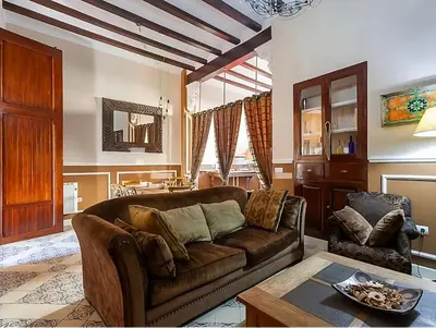 a living room with a couch and a table at La Isla del Júcar in Barraca de Aguas Vivas