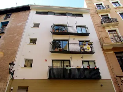 a white building with balconies and plants on it at Your Home at Valencia, El Carme in Valencia