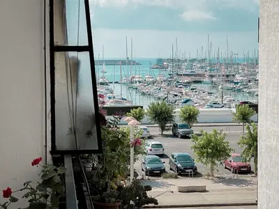 a view of a marina with cars parked in a parking lot at Disfruta de unos días en la playa ¡Y mucho más! in Burriana