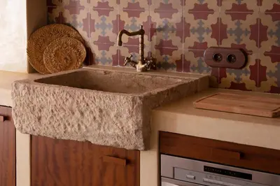 a kitchen with a stone sink in a kitchen at Natural loft in Valencia