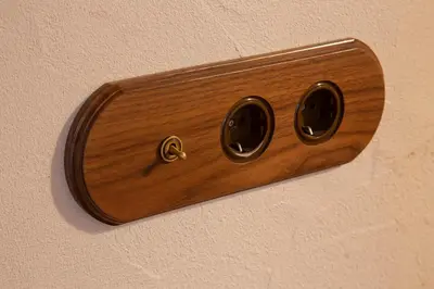a wooden lightswitch on a wall with at Natural loft in Valencia