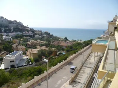 a view of a street from a building with a car at Hetesa 2000, 3º-7 in Cullera