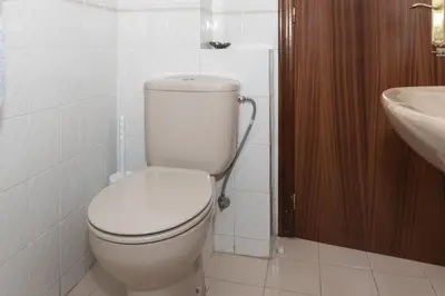 a bathroom with a white toilet and a sink at EL RACO- C, 8-16 in Cullera