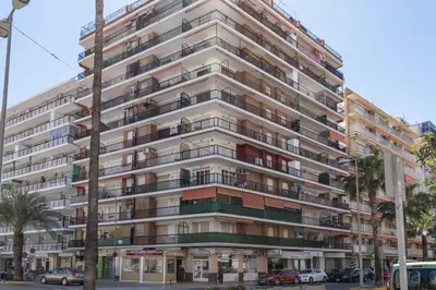 an apartment building with balconies on a city street at Europa A- 12º-23 in Cullera