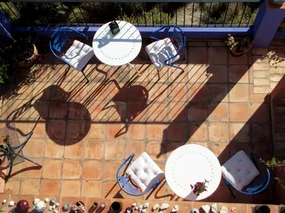 an overhead view of two tables and chairs on a patio at Sharíqua in Jérica