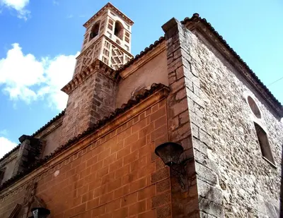 a brick building with a clock tower on top of it at Sharíqua in Jérica