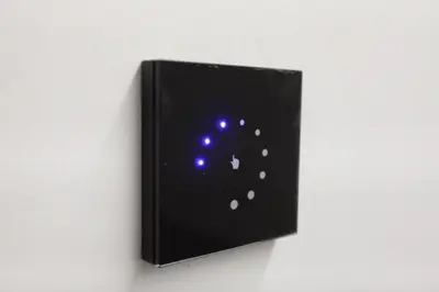 a black box with blue lights on a wall at 5 SENSES in Valencia