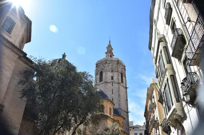a church with a tower in the middle of a street at Homely Nest Valencia El Carme in Valencia