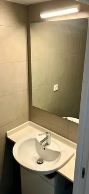 a bathroom with a sink and a mirror at Loft with terrace 24m2, swimming pool and garage in Chirivella