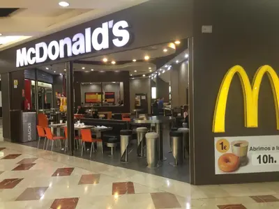 a mcdonalds fast food restaurant with tables and chairs at Loft with terrace 24m2, swimming pool and garage in Chirivella