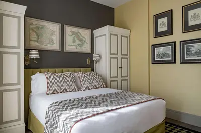 a bedroom with a bed in a room at NH Collection Colón Valencia in Valencia