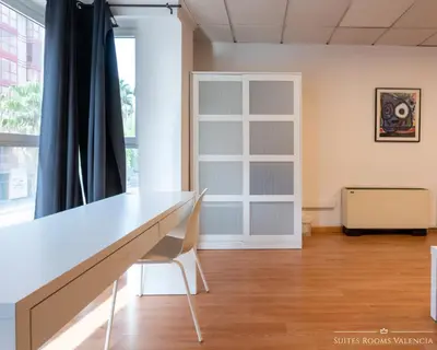 a white desk in a room with a window at Suites Rooms Valencia in Valencia