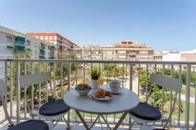 a table with a bowl of food on a balcony at Valencia Flat Rental Malvarrosa Beach zone in Valencia