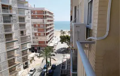 a view of the beach from the balcony of a building at 1 Bedroom Nice Apartment In Cullera in Cullera