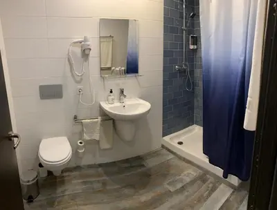 a bathroom with a sink and a toilet and a shower at Nanit Valencia Hostel in Valencia