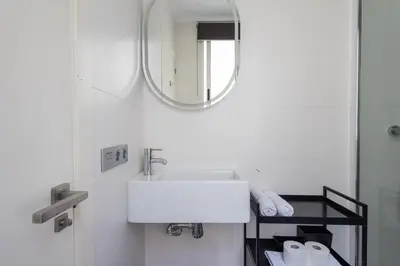 a dining room table with chairs and a table with plates and dishes at FLORIT FLATS - Stylish 2 Bedroom AC Wifi Terrace Attic in Valencia Center in Valencia