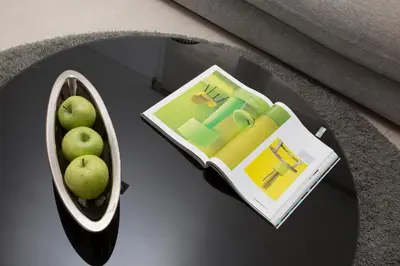 a table with a book and a bowl of apples on it at SingularStays Poeta Querol in Valencia