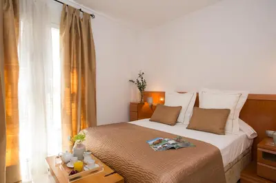 a bedroom with a bed and a window and a table at SingularStays Poeta Querol in Valencia