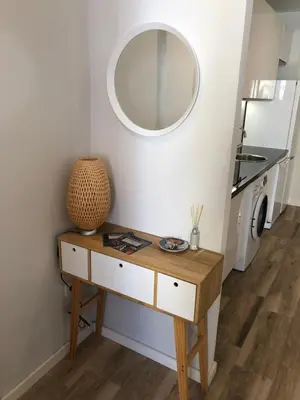 a dressing table with a mirror on a wall at Botanic in Valencia