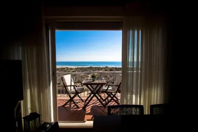 a view of a balcony with a table and chairs at Perfecto apto a orillas del mediterráneo / 4PAX in El Perellonet