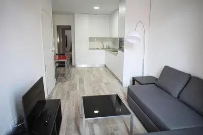 a living room with a couch and a table at NWT Central Station Apartments in Valencia