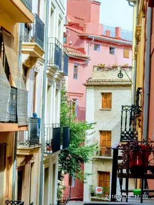 a view of an alley between two buildings at Valencian Dreams of the Proletariat in Valencia