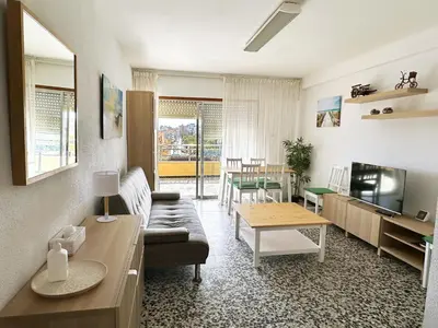 a living room with a couch and a table at Apartamento Careme in Tavernes de Valldigna