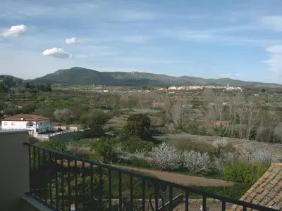 a view from the balcony of a house with mountains in the background at Apartamentos rurales Benafer in Benafer