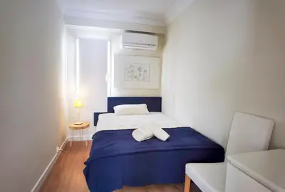 a bedroom with a bed with two towels on it at TTdSSa VLC Plaza Cisneros in Valencia