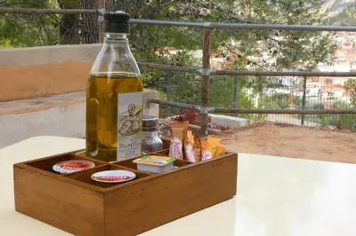 a bottle of wine sitting on top of a table at Hotel de Montaña La Rocha in Quesa