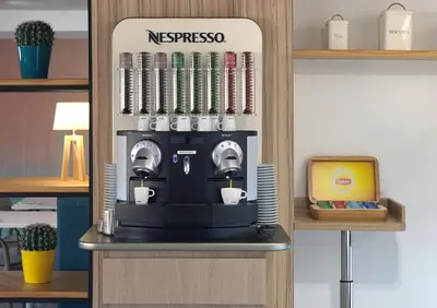 a coffee machine on a shelf in a room at Hotel Belcaire in Vall de Uixó