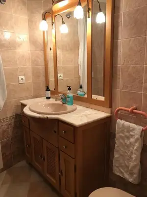 a bathroom with a sink and a mirror at Retiro Playa y Spa in Tavernes de Valldigna