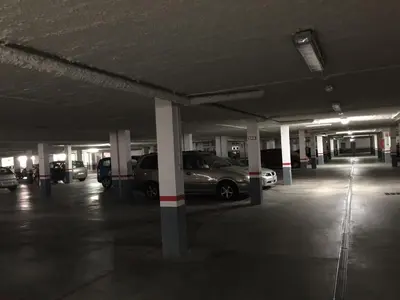 an empty parking garage with cars parked in it at Retiro Playa y Spa in Tavernes de Valldigna