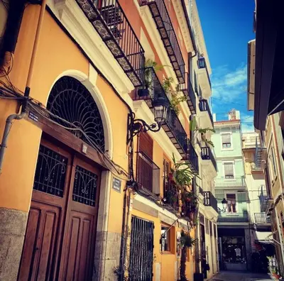 a building with doors and balconies on a street at Mediterranean Flats Plaza Redonda in Valencia