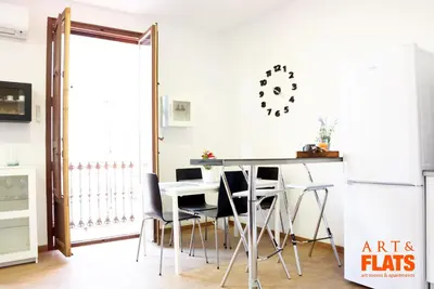 a dining room with a table and chairs at Calle Cuenca in Valencia