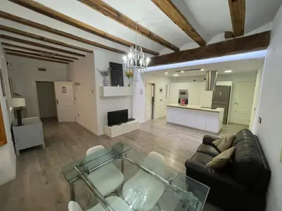 a living room with a glass table and a couch at Amplio apartamento en centro histórico in Valencia