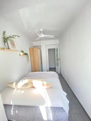 a bedroom with a bed with a ceiling fan at Beach Malvarrosa, Cabañal, Wifi free. Ca' Micaela. in Valencia