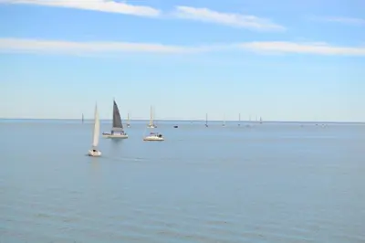 a group of boats floating in the water at Beach Malvarrosa, Cabañal, Wifi free. Ca' Micaela. in Valencia