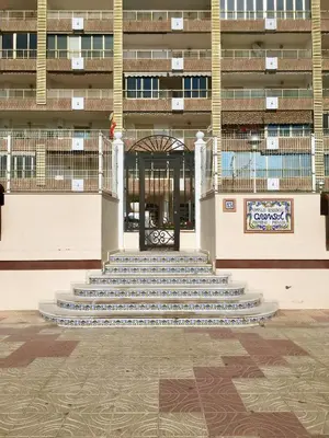 a group of stairs in front of a building at Apartamento en la playa Arensol Cullera in Cullera