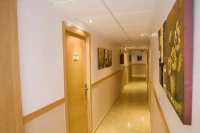 a corridor in a building with a hallway at Hostal Casa Paco in Chilches