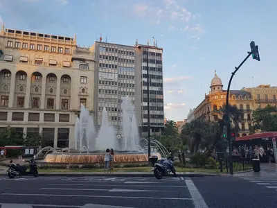 a fountain in the middle of a city with buildings at Bianca in Valencia